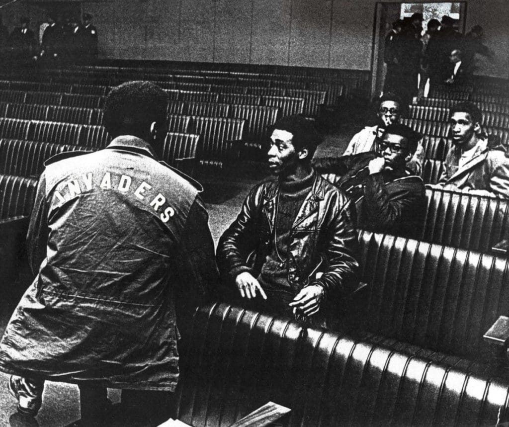 John Burl Smith, left, with his back to the camera, and Invaders co-founder Charles Cabbage, center, gather with other members of the Invaders at Memphis City Hall, ca. 1968. This photo was used in the official poster and banner for “The Invaders,” a documentary directed by Prichard Thomas Smith, which was released in 2016. (Photo courtesy University of Memphis Special Collections)