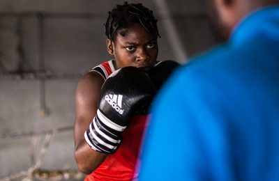 11 July 2019: Princess Oluwapelumi Adewale, a 17-year-old boxer in a training session with her coach at the National Stadium in Lagos, Nigeria.